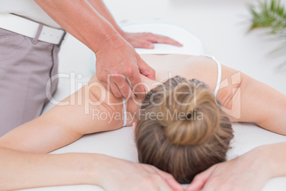 Physiotherapist doing shoulder massage