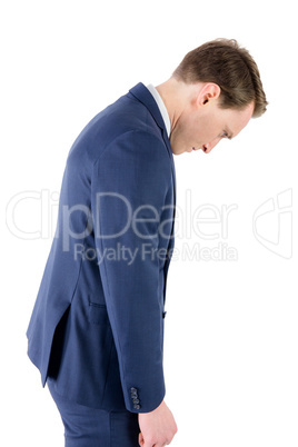Defeated businessman looking down