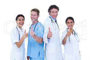 Doctors and nurse gesturing thumbs up