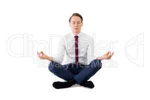 Zen businessman meditating in yoga pose