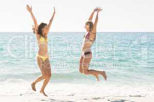 Happy friends jumping together