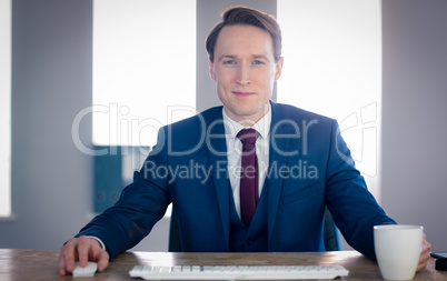 Confident businessman looking at camera