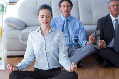 Business people practicing yoga