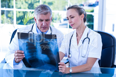 Medical team looking at xray together