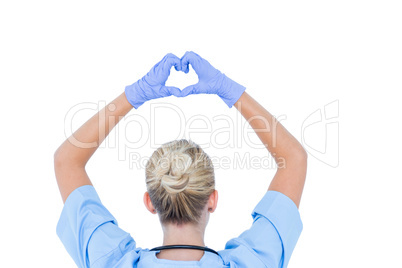 blond female doctor doing an heath sign