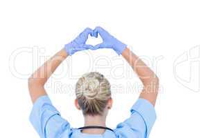 blond female doctor doing an heath sign