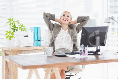 Businesswoman relaxing in a swivel chair