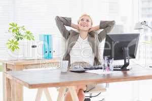 Businesswoman relaxing in a swivel chair