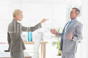 Businesswoman giving out to her boss