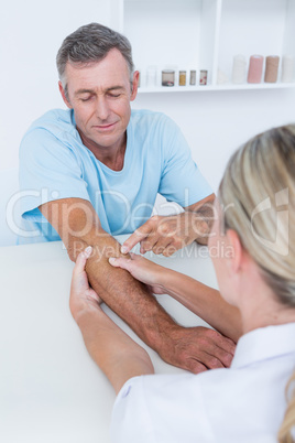 Doctor doing arm massage