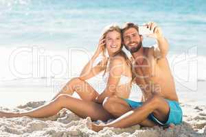 Happy couple taking selfie