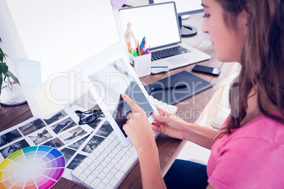 Creative young businesswoman using tablet