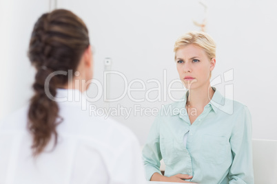Unhappy patient speaking with doctor