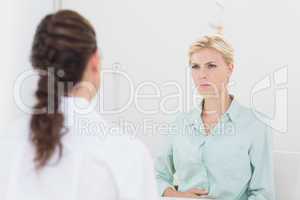 Unhappy patient speaking with doctor