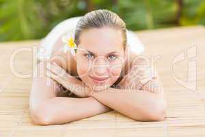 Peaceful blonde lying on towel