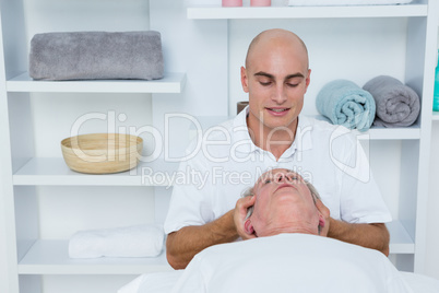 Man receiving neck massage