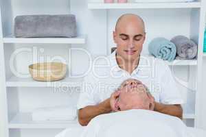 Man receiving neck massage