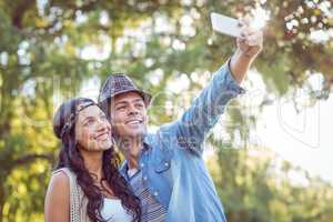 Hipster couple taking a selfie