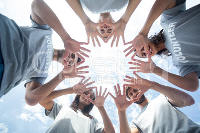 Happy volunteers playing with their hands