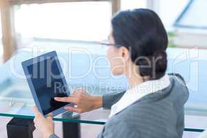 Businesswoman using tablet pc