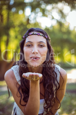 Pretty brunette blowing a kiss