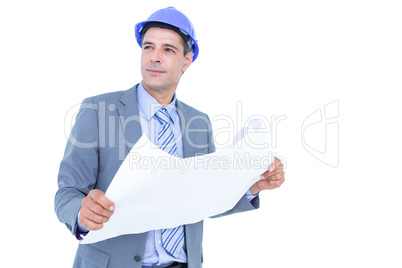 Businessman looking at a blueprint