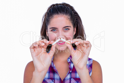 Happy pretty brunette snapping cigarette