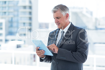 Businessman using his tablet Businessman using his tablet