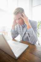 Depressed businessman at his desk