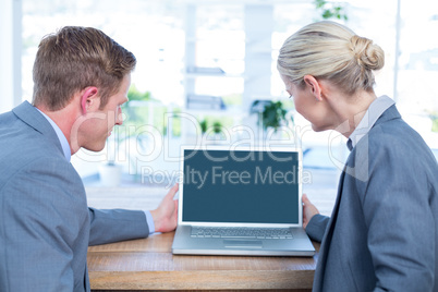 Business people watching laptop