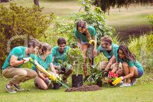 Happy friends gardening for the community