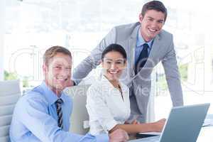 Business people using laptop