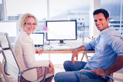 Happy business colleagues smiling at the camera