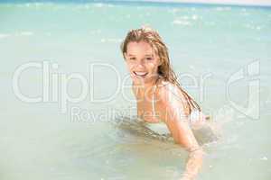 Happy pretty blonde bathing into the sea