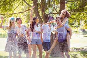 Happy friends jumping in the water shoot