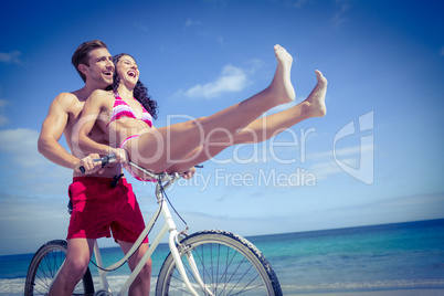 Happy couple going on a bike ride