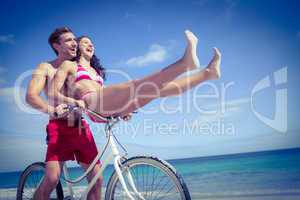 Happy couple going on a bike ride