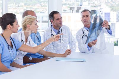 Doctor showing Xray to his colleagues