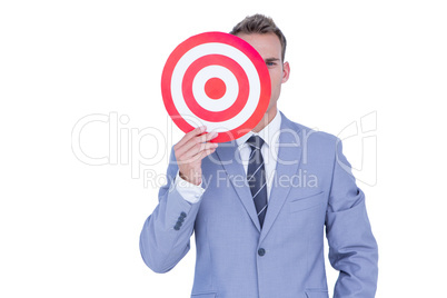 Handsome businessman holding target Handsome businessman holding target
