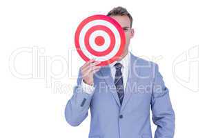 Handsome businessman holding target