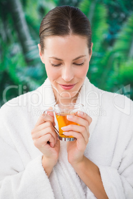 Close up portrait of a beautiful young woman drinking a tea