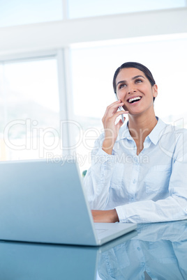 Smiling businesswoman having a phone call