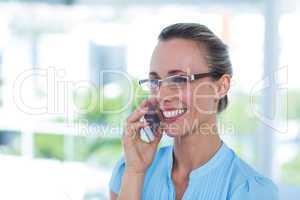 Smiling businesswoman having a phone call