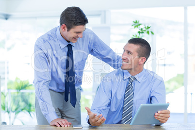 Businessmen using tablet