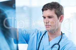 Concentrated doctor analyzing xray