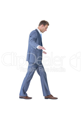 Businessman walking in equilibrium