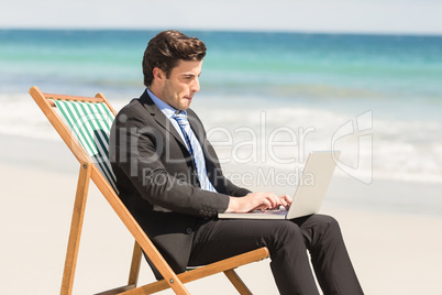 Businessman using his laptop