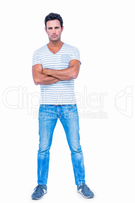 Serious man with arms crossed looking at camera