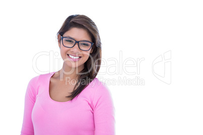 Pretty brunette wearing glasses and smiling at camera