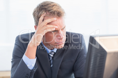 Businessman with his hand on his forehead